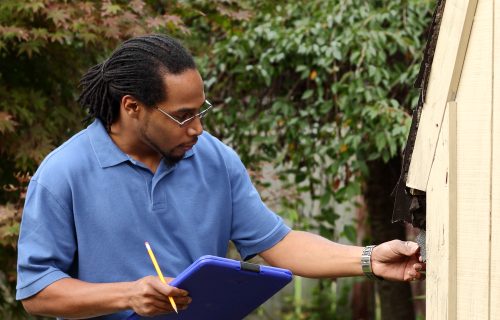 Inspecting,Damaged,Roofing,Shingles